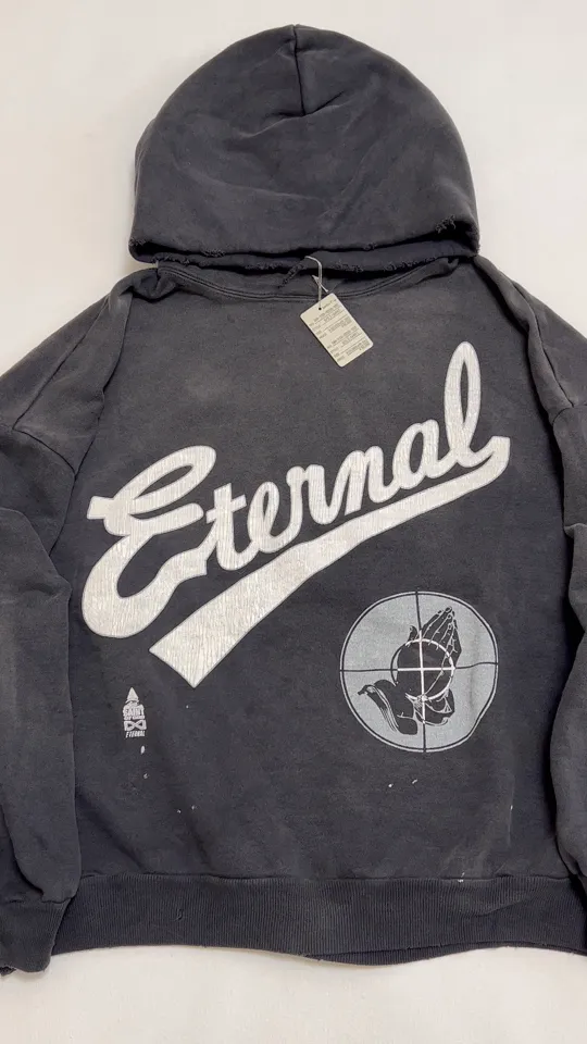SAINT Mxxxxxx × FEAR OF GOD FG_HOODIE/SNT OF GOD/BLK FOG joint model ETERNAL praying crosshair distressed hoodie. Washed black S-XL. This season's popular super popular joint model. The original version is the same. Thin spring and summer fabrics. The upper body is comfortable. The BOXY version of the short fat wide shoulder line. Fashion darling wears it with a high-end feel. Heavy washing and water fading technology. The horse is repositioned. Excessive wear and damage graffiti treatment. Correct version FOG joint main mark/wash water mark/little angel label